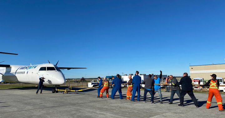 Plane pull at Edmonton airport raises money, awareness for Hope Air